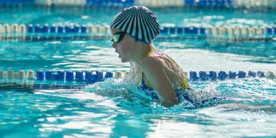 swimmer-child-swims-breaststroke-swimming-style-in-the-pool.jpg